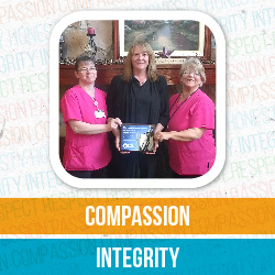 Amy Scogna, Lisa Sivec, and Beth Raley smile while holding their PHCA Quality Award.