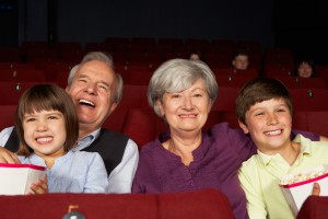 grandparents watching movie with kids