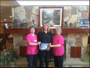 Pictured left to right: Bethany Raley, Lisa Sivec, and Amy Scogna smile and hold their award from PHCA